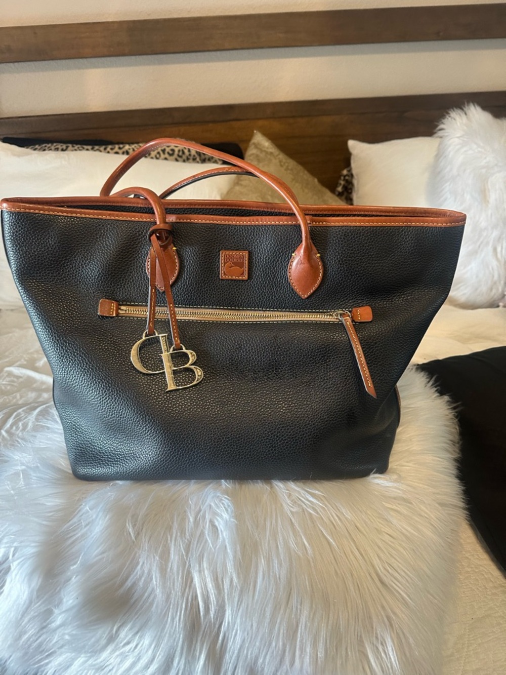 Dooney & Bourke Black Pebbled Tote with Brown Trim and Cream Interior